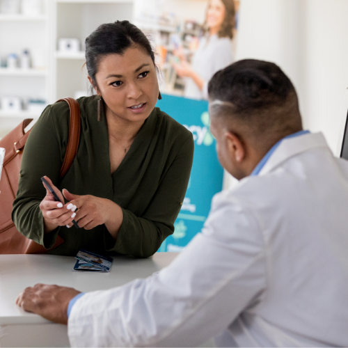 a woman talking with a doctor