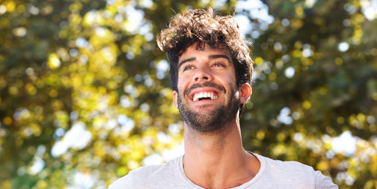 A man smiling confidently